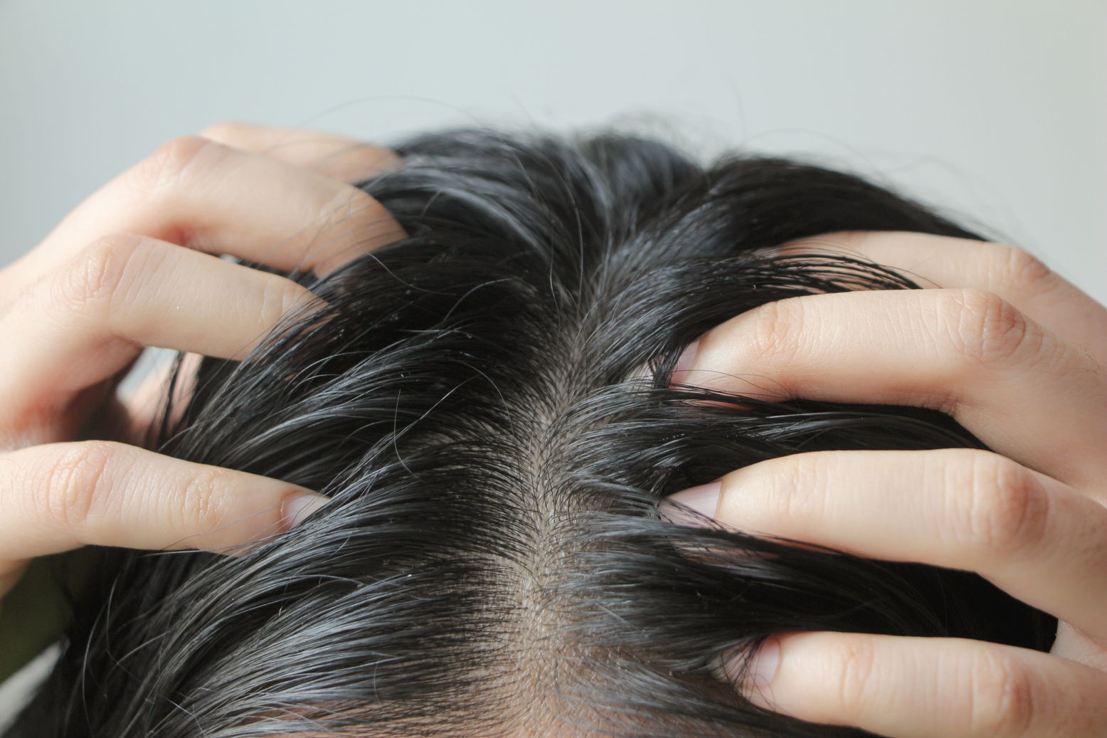 Close-up on head of Asian people have long black hair, having pr